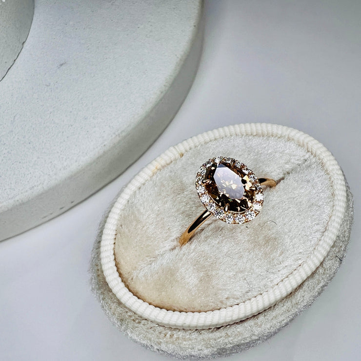 Natural Champagne Diamond Engagement Ring in Yellow Gold with a delicate diamond halo.  Shown in a white box