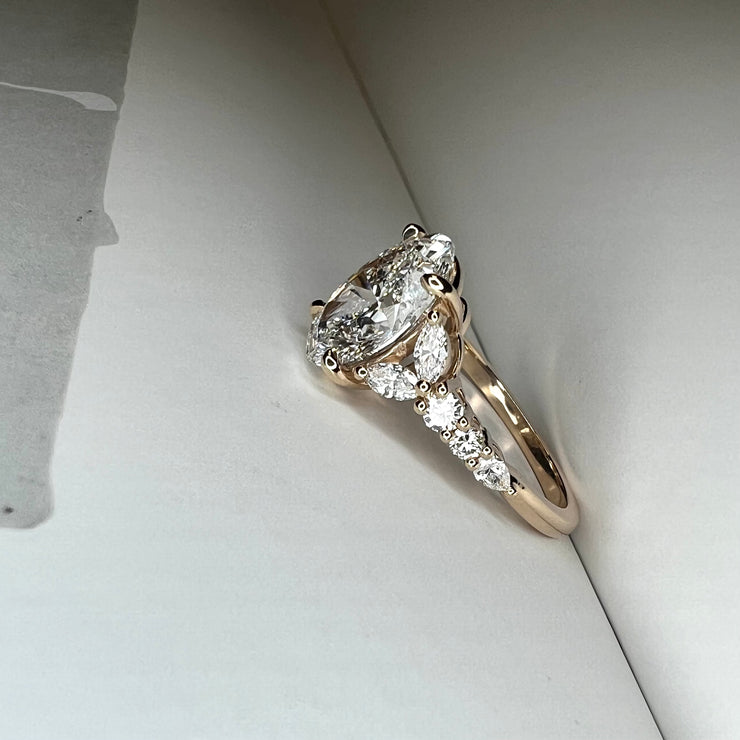 Unique Oval Lab Grown Diamond Engagement Ring With Marquee And Pear Shape Diamonds Accents in Yellow Gold