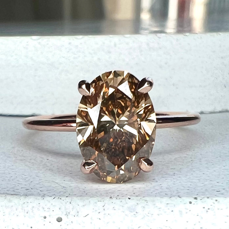 2.01 carat champagne diamond engagement ring in oval cut and 14k rose gold with thin dainty band