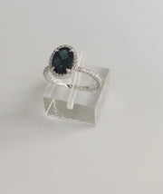 VIDEO Teal sapphire with diamond halo and diamond micro pave set in white gold. DANA WALDEN BRIDAL. 