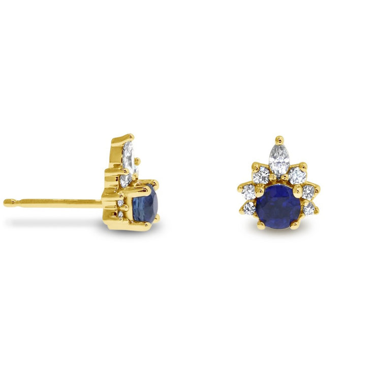 Deep blue sapphire earrings with diamond demi halo. Stud earrings set in yellow gold by Dana Walden.