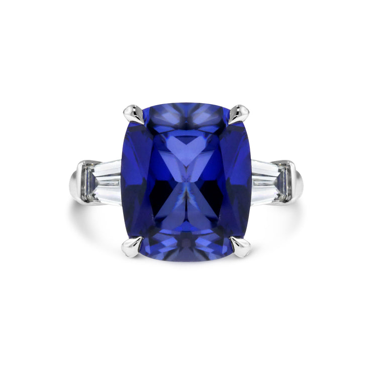 Deep blue sapphire engagement ring with baguette diamonds. DANA WALDEN BRIDAL.