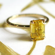 Unique emerald cut yellow sapphire engagement ring in gold - nontraditional & alternative