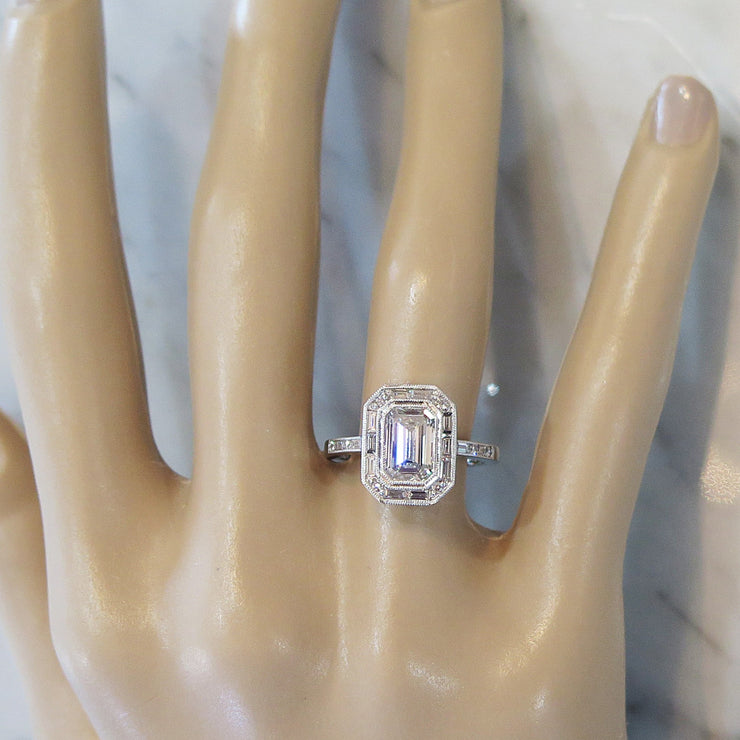 Emerald Cut Diamond Halo with Baguette & Round Diamond Accents on Hand