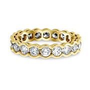 2 carat diamond eternity band 'Gilda' in yellow gold with a scalloped bezel by Dana Walden Bridal nyc