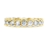 2 carat diamond eternity band 'Gilda' in yellow gold with a scalloped bezel by Dana Walden Bridal nyc - font view