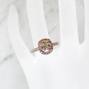 Delicate cushion cut diamond halo with light yellow diamond in rose gold on hand - Shelby