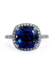 Blue sapphire and diamond halo engagement ring by Dana Walden NYC.