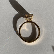 Oval diamond engagement ring, yellow gold solitaire, low profile & delicate, on hand, 2 carat diamond