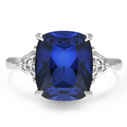 4 carat sapphire engagement ring with trillion diamond accents. DANA WALDEN BRIDAL.