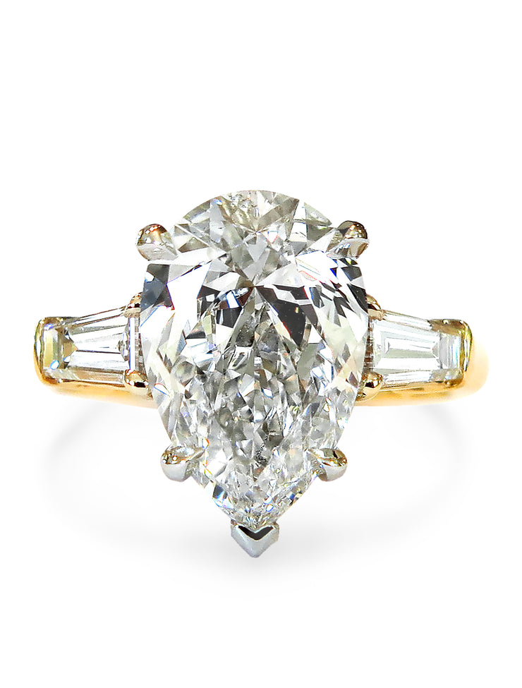 2 carat pear shaped engagement ring in yellow gold with baguette accent stones. DANA WLADEN BRIDAL.