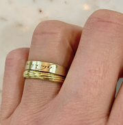 Gold Loving Day wedding band ring on Dana's hand. DANA WALDEN NYC.