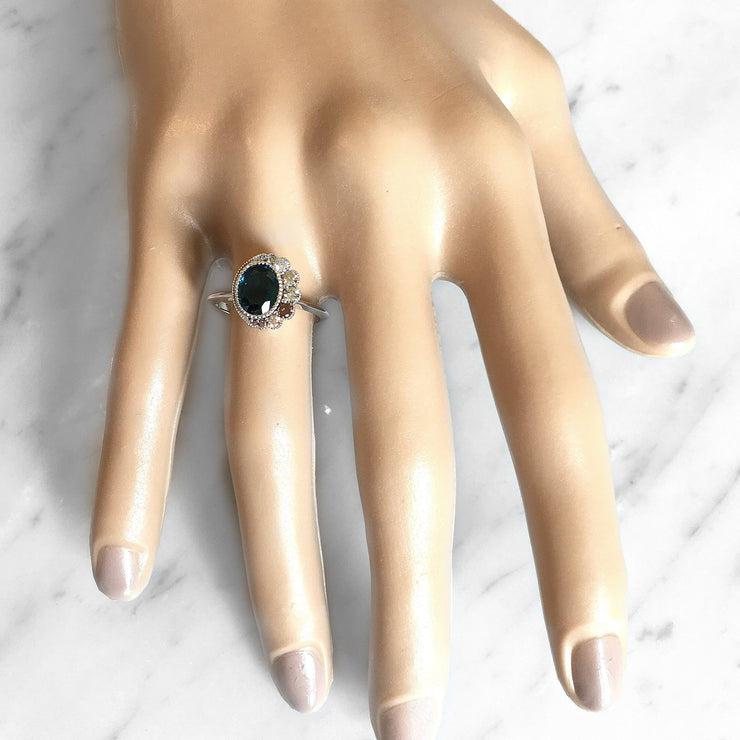 Solaris blue sapphire engagement ring on a model hand. Dana Walden Bridal NYC.