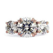 Three stone diamond engagement ring in rose gold. Dana Walden Bridal NYC.