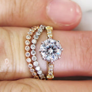 A detailed vintage-inspired solitaire engagement ring with two handmade curved bands. Dana Walden NYC.