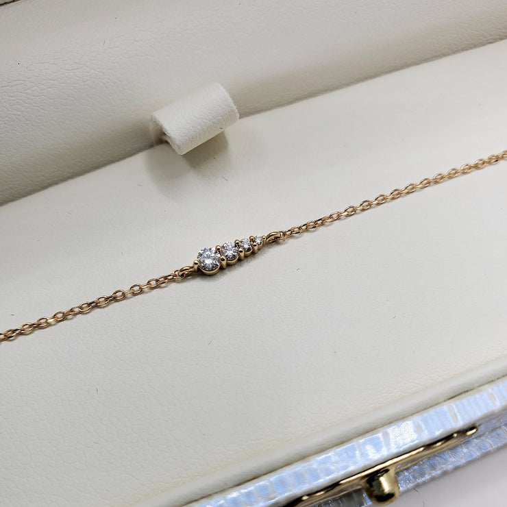 Rise 4 diamond gradating bracelet with petite stones and delicate adjustable chain in 14k yellow gold by Dana Walden Bridal in gift box