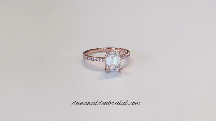 Video of a rose gold emerald cut engagement ring.
