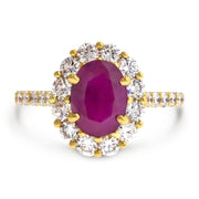 Ruby engagement ring with diamond halo by DANA WALDEN.