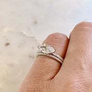 Dana Walden conflict-free diamond marquise engagement ring with a micro pave wedding band. Made in NYC.