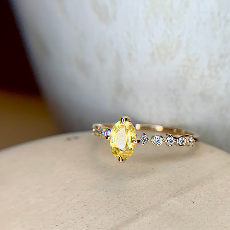 Oval yellow sapphire engagement ring in yellow gold with diamond accents & NSEW prongs by Dana Walden Bridal, NYC