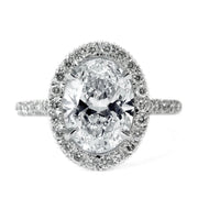 Conflict free oval diamond halo engagement ring by Dana Walden Jewelry in NYC.