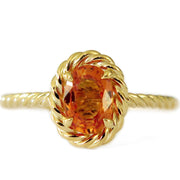 Orange sapphire engagement ring with gold cable halo and twisted band. DANA WALDEN BRIDAL.