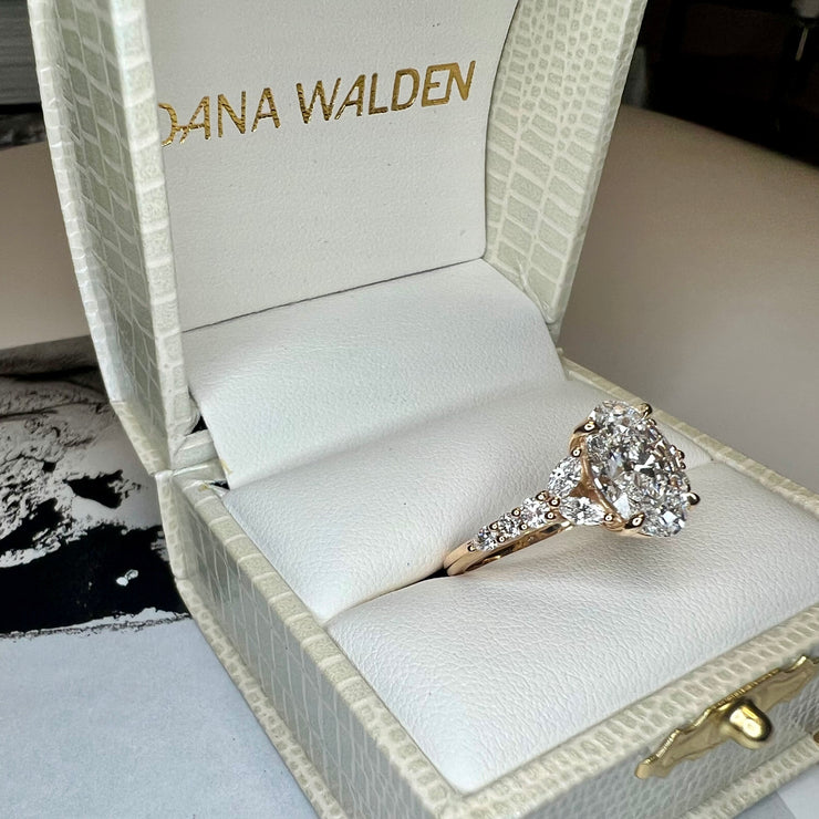Shown In Box Unique Oval Lab Grown Diamond Engagement Ring With Marquee And Pear Shape Diamonds Accents in Yellow Gold