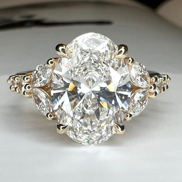 Unique Oval Lab Grown Diamond Engagement Ring With Marquee And Pear Shape Diamonds Accents in Yellow Gold