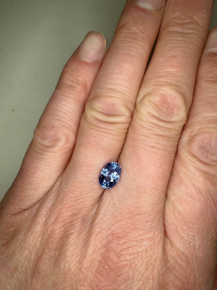 2.87 Carat Oval Light Blue Sapphire Unique Engagement Ring Diamond Alternative Shown On Hand
