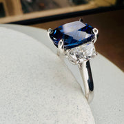 Unique Sapphire Alexandra lab sapphire engagement ring with half-moon, lunette diamonds side view. DANA WALDEN BRIDAL.