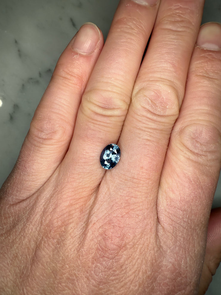 3.00 Carat Oval Light Blue Sapphire Unique One of  Kind Natural Sapphire for custom engagement ring shown on hand for scale