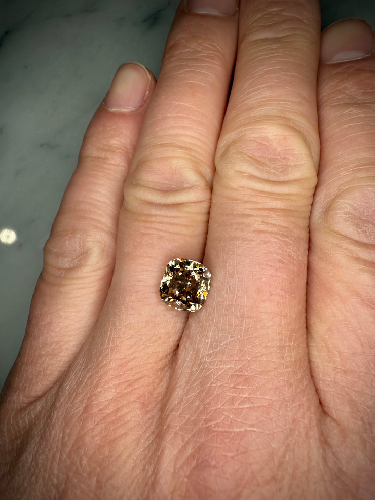 3.36 Carat Cushion Cut Natural Champagne Diamond Shown On Hand