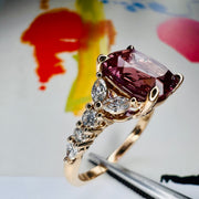 Rossi 2.6 Carat Lab Grown Cushion Cut Alexandrite Engagement Ring Shown with painting in the background NYC