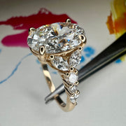 Side View of Unique Oval Lab Grown Diamond Engagement Ring With Marquee And Pear Shape Diamonds Accents in Yellow Gold