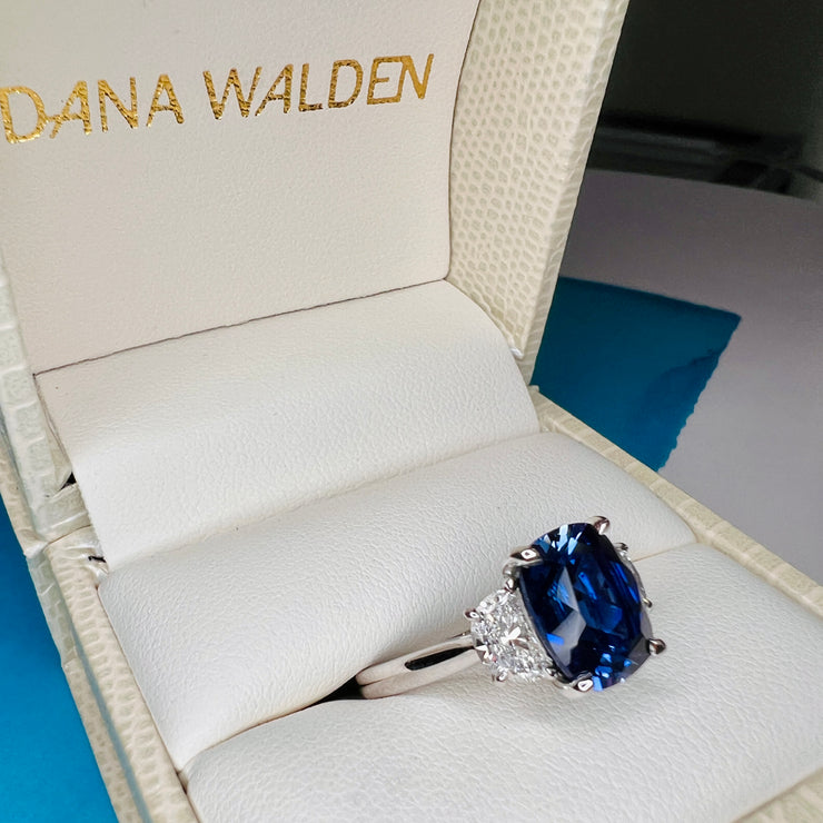 Unique Sapphire Alexandra lab sapphire engagement ring with half-moon, lunette diamonds. Shown in the ring box - DANA WALDEN BRIDAL.