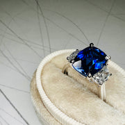Unique Sapphire Alexandra lab sapphire engagement ring with half-moon, lunette diamonds. DANA WALDEN BRIDAL.