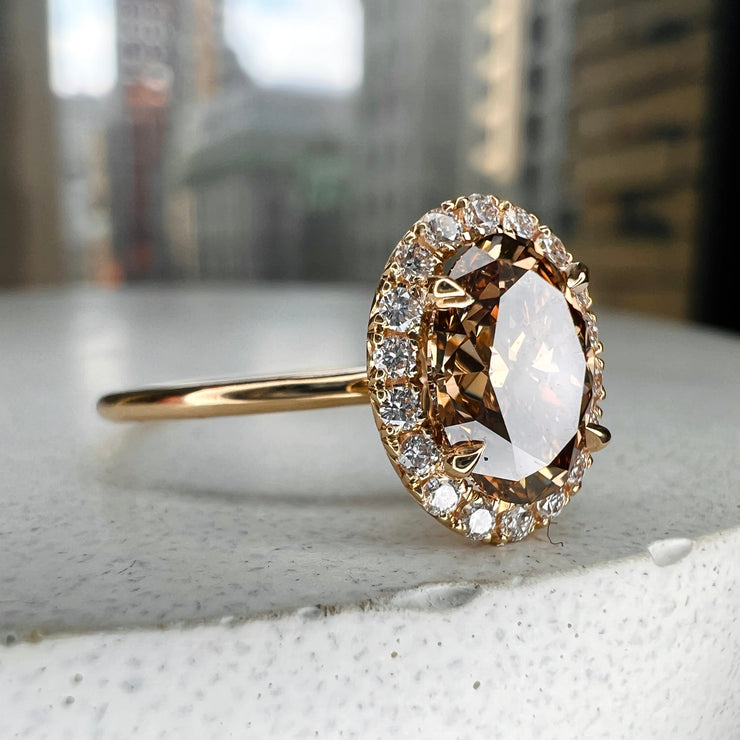 Natural Champagne Diamond Engagement Ring in Yellow Gold with a delicate diamond halo.  Side View