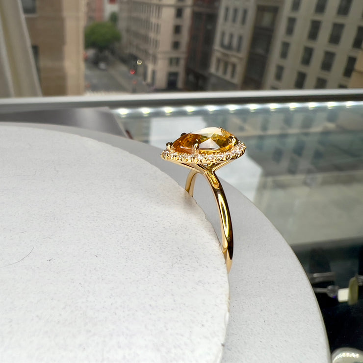 Dana Walden 5th Avenue Showroom In The Background of Nola 2.64 Carat Natural Oval-Cut Yellow Sapphire Halo Engagement Ring Eco-Friendly 18k Yellow Gold