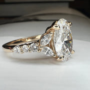 Side View Unique Oval Lab Grown Diamond Engagement Ring With Marquee And Pear Shape Diamonds Accents in Yellow Gold