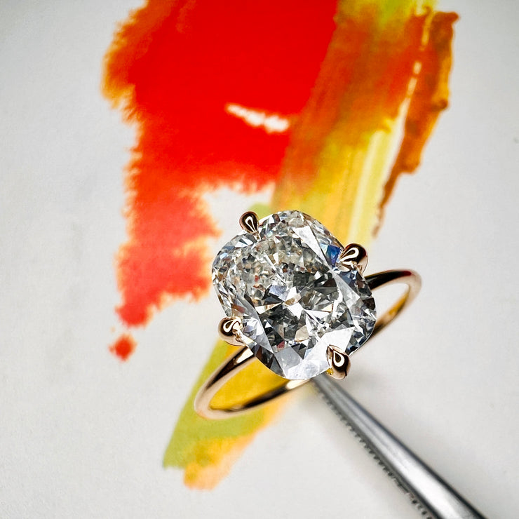 Mia 1.90 Ct Cushion Cut Lab Grown Diamond Engagement Ring with Hidden Halo shown on colorful artwork