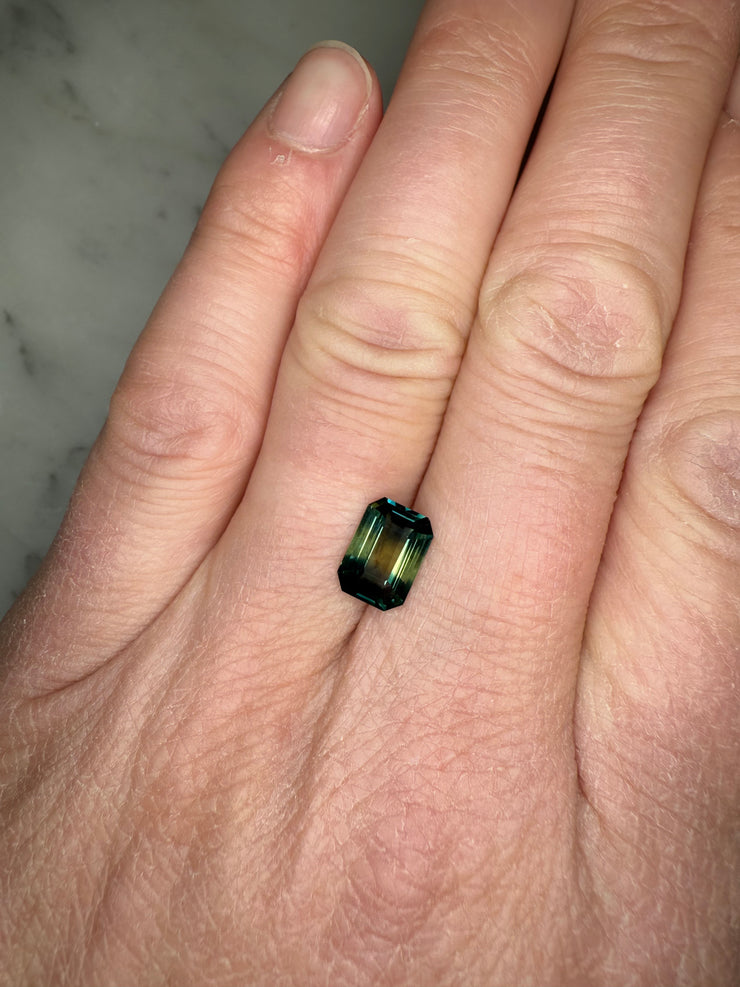 One of a kind natural 2.51 Carat Emerald Cur Bi-color Green Sapphire shown on hand for proportion 