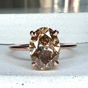 2.01 carat champagne diamond engagement ring in oval cut and 14k rose gold with thin dainty band