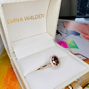 Natural Champagne Diamond Engagement Ring in Yellow Gold with a delicate diamond halo.  Shown in the ring box
