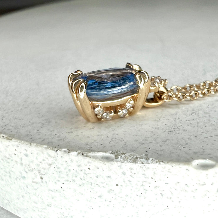 Victoria Natural Oval Blue Sapphire & Diamond Layering Gold Necklace Shown On Marble