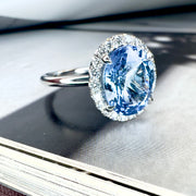 Shown from the side Della 3.24ct Natural Oval-Cut Light Blue Sapphire Halo Engagement Ring Eco-Friendly Platinum