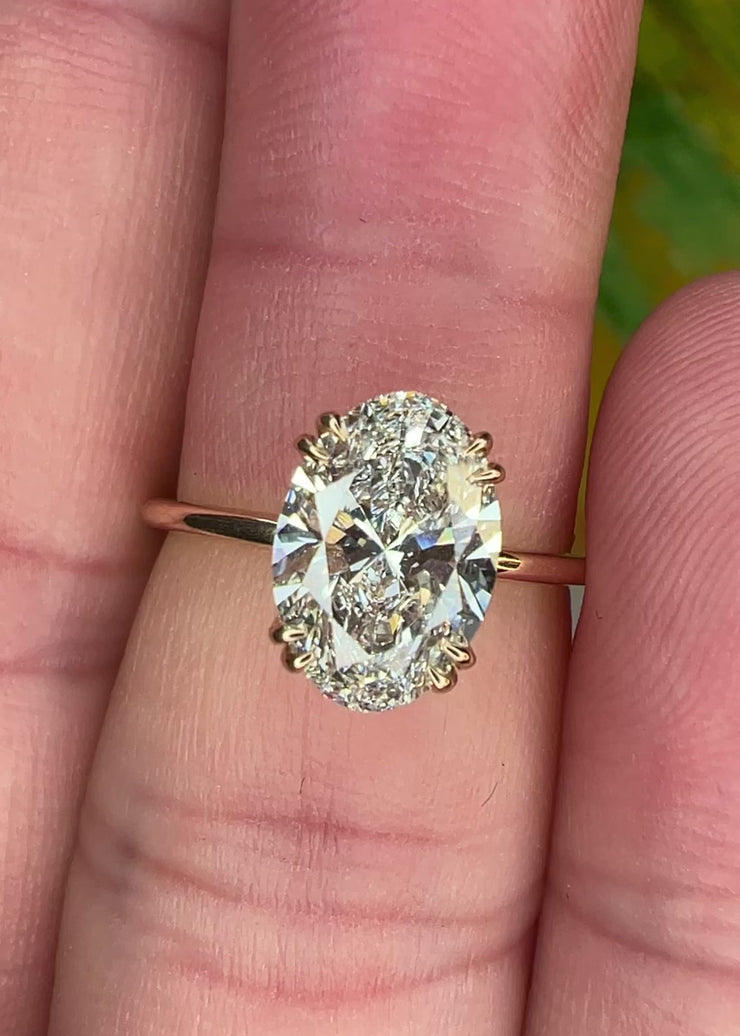 Video On The Finger of the Jessa Delicate 2 Carat Lab Grown Oval Diamond Engagement Ring with Hidden Halo in Yellow Gold with double claw prongs - Designed for a wedding band to sit flush NYC 