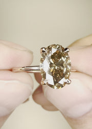 Video of Alessia champagne diamond engagement ring with oval diamond in 14k rose gold setting with hidden halo and thin band