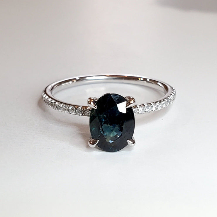 Uma oval teal sapphire engagement ring in 14k white gold with thin micro-pave diamond band 