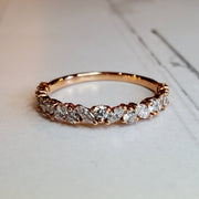 Unique diamond wreath wedding band in 14k rose gold with round and marquise diamonds in half band