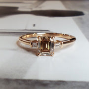 Emerald-cut champagne diamond engagement ring- three stone ring with ethical accent diamonds by DANA WALDEN BRIDAL NYC.